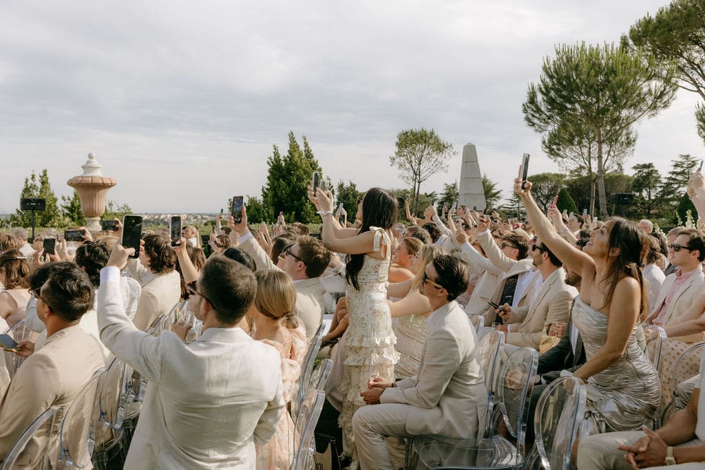 Guests cheer for newlyweds at a destination wedding in Italy held at Villa Miani Rome 