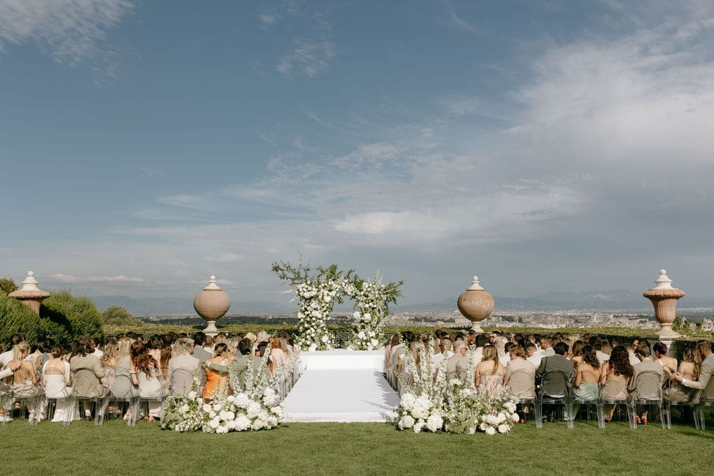 The ceremony area at a villa miani rome wedding is photographed at a distance 