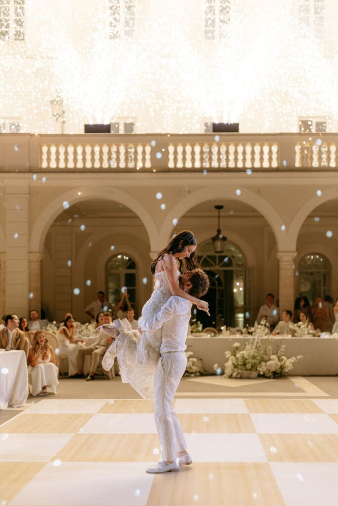 Newlyweds pose for a photo at their villa miani rome wedding reception 
