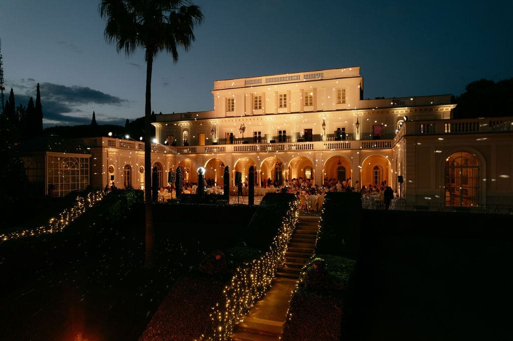 Villa Miani in Rome is photographed after dark with twinkling lights at a destination wedding in Italy 